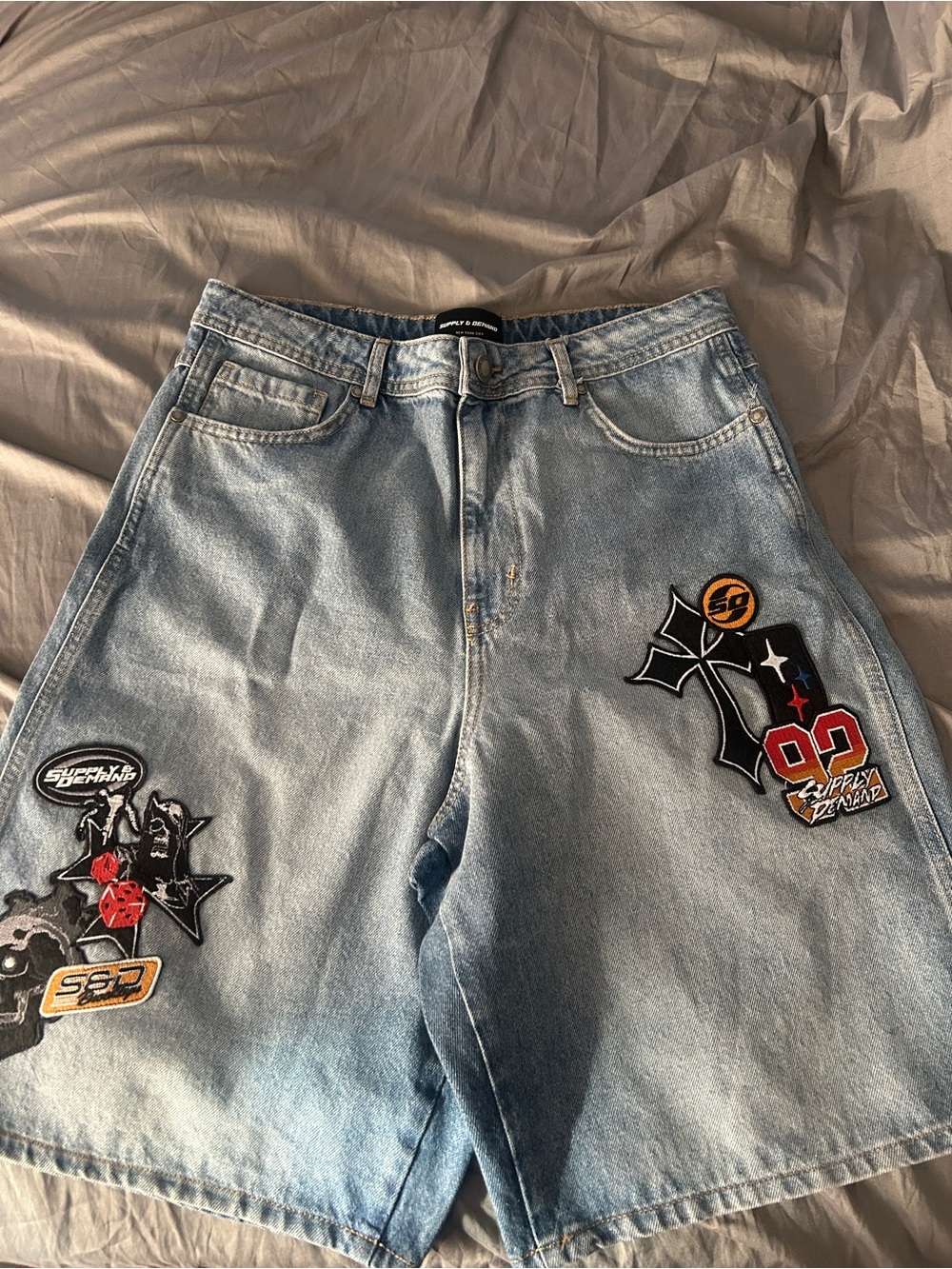 Relaxed Light Blue Denim Shorts with Patch Accents